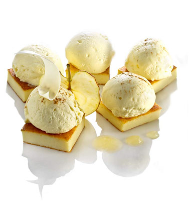 Cream foam with white chocolate on sponge cake